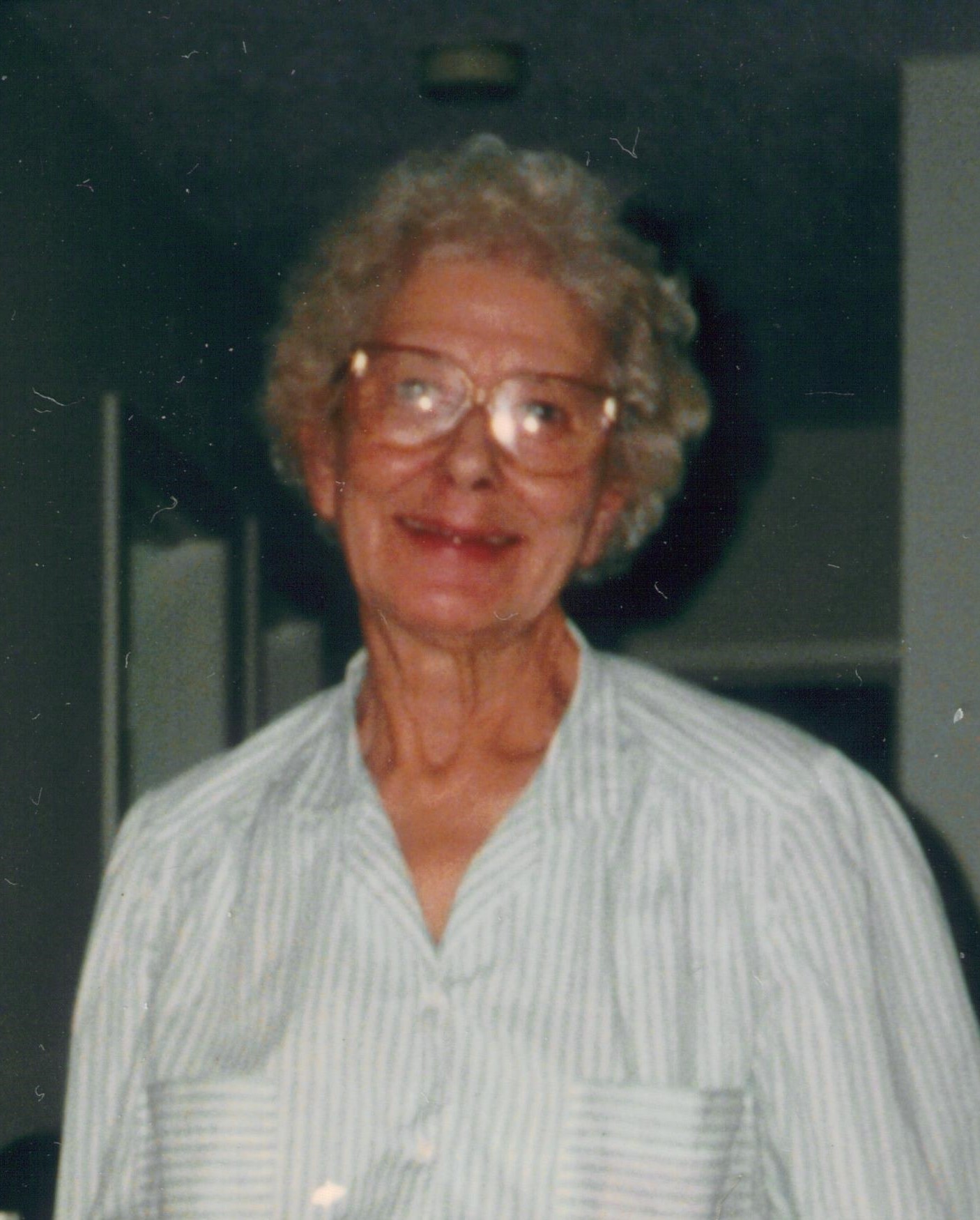 Edith in a white shirt