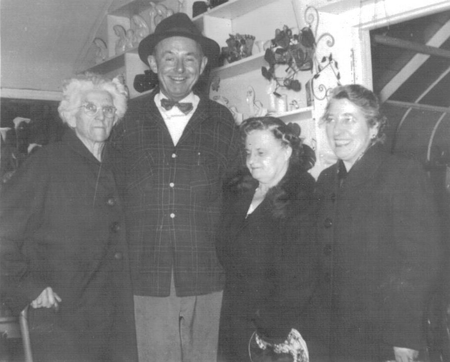 4 people in a shop